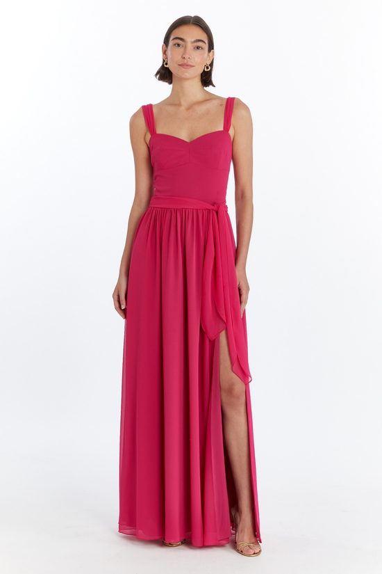 Girl in long red maxi dress with slit, front facing. view 1