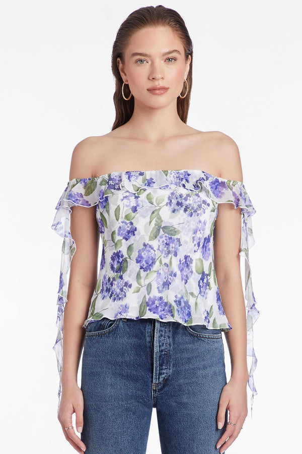 blue and white floral print strapless blouse with ruffle trim on arms
