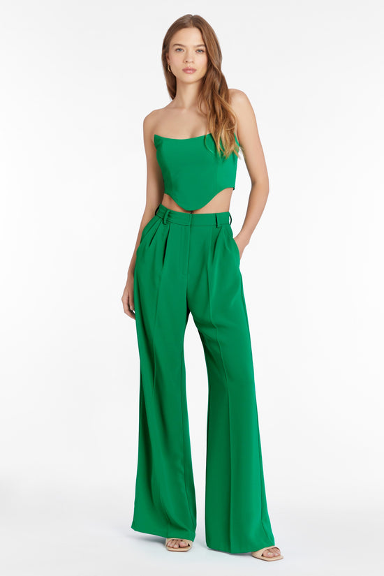 Girl in green top and pants set, front facing. view 1