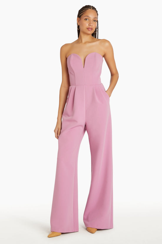 Girl in pink jumpsuit, front facing. view 2