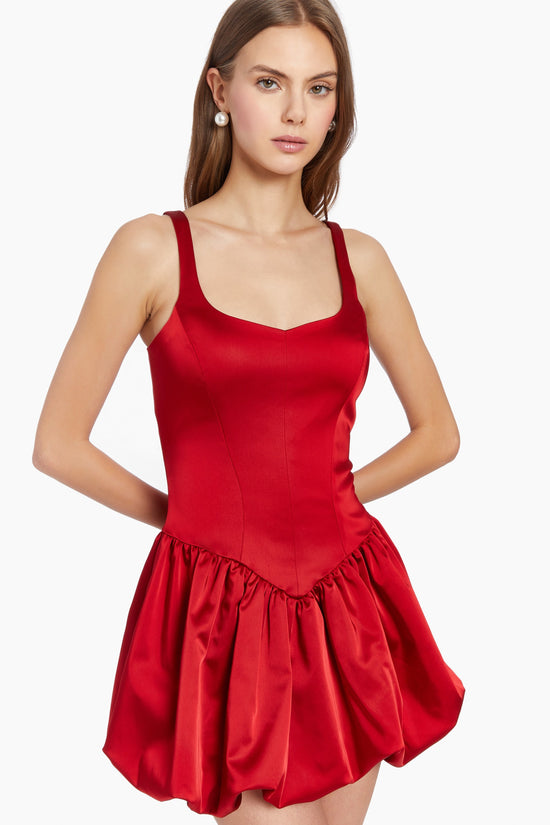 Girl in red dress with bubble hem, front facing. view 2