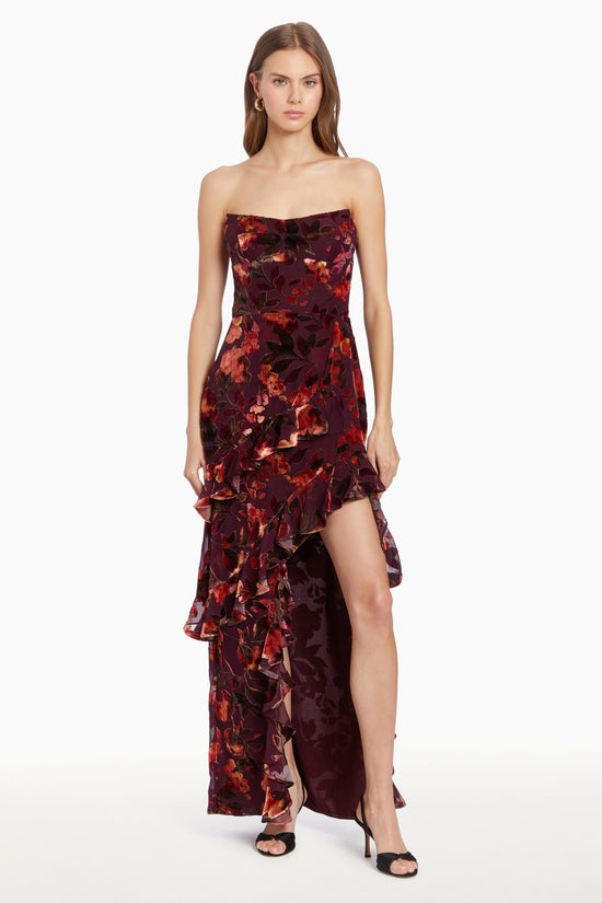 Girl in floral maxi dress with slit and ruffles, front facing. view 1