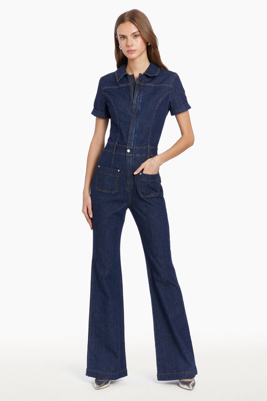 Girl in denim jumpsuit, front facing. view 1