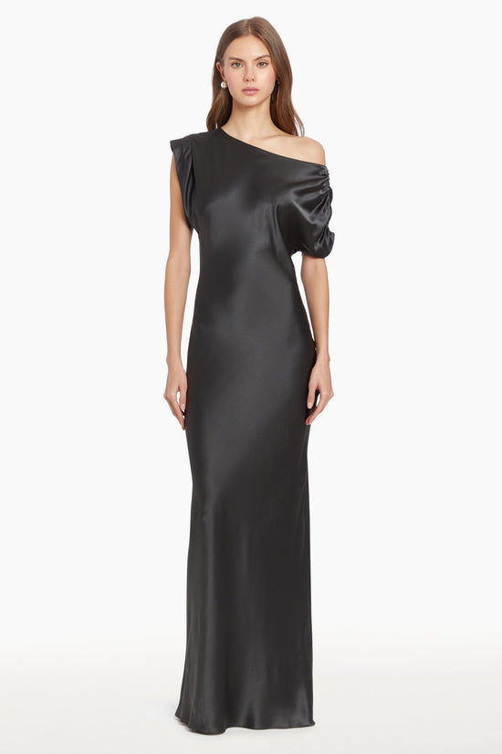 Girl in silk one shoulder black maxi dress, front facing. view 2