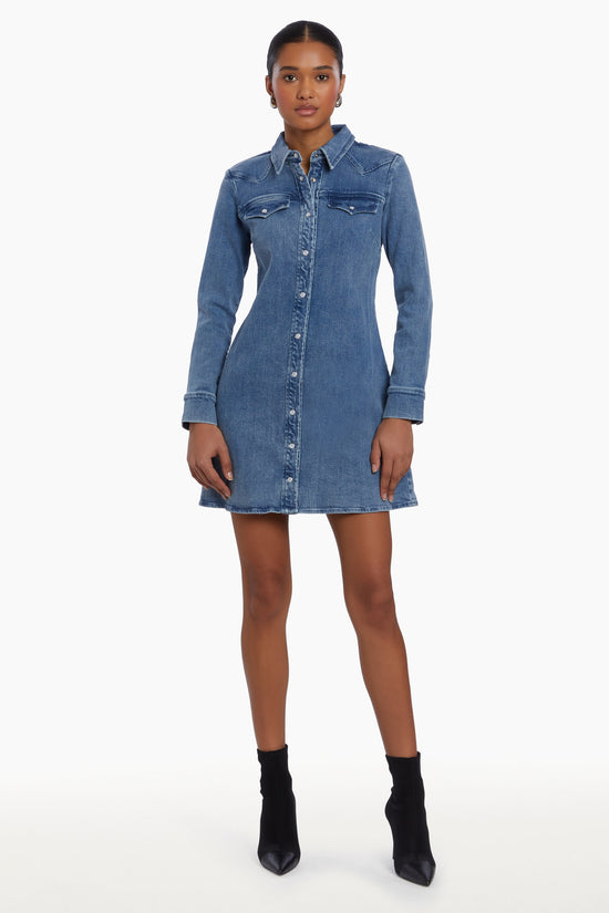 Girl in long sleeve denim dress, front facing. view 2