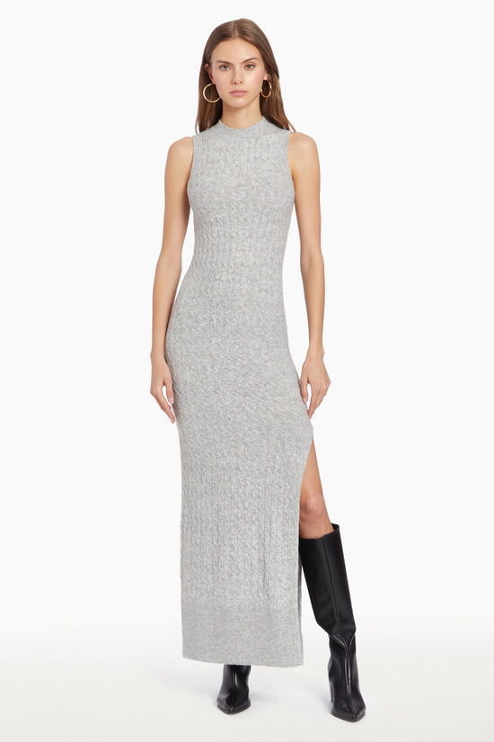 Girl in grey knit dress with slit, front facing. view 1