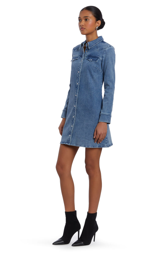 Girl in long sleeve denim dress, side facing. view 1