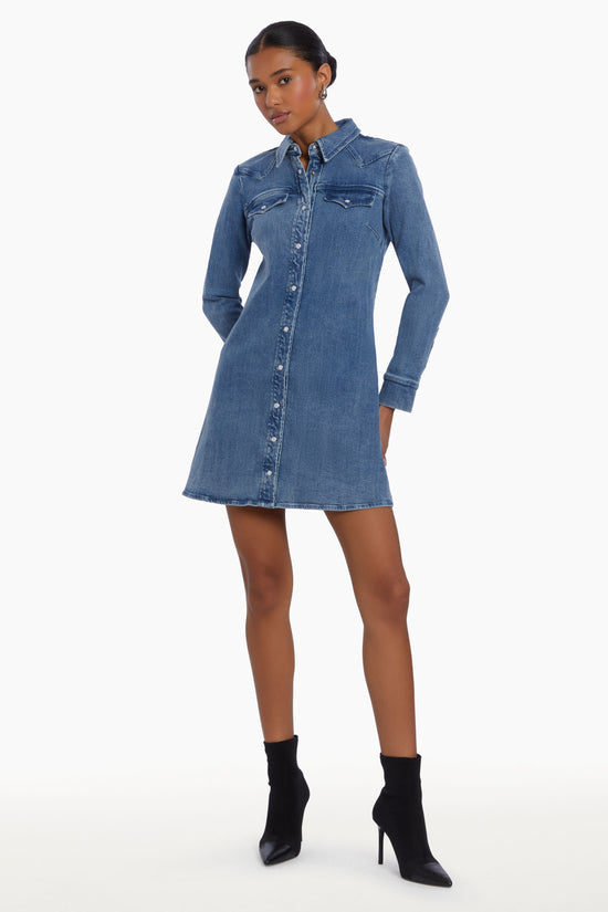 Girl in long sleeve denim dress, front facing. view 2