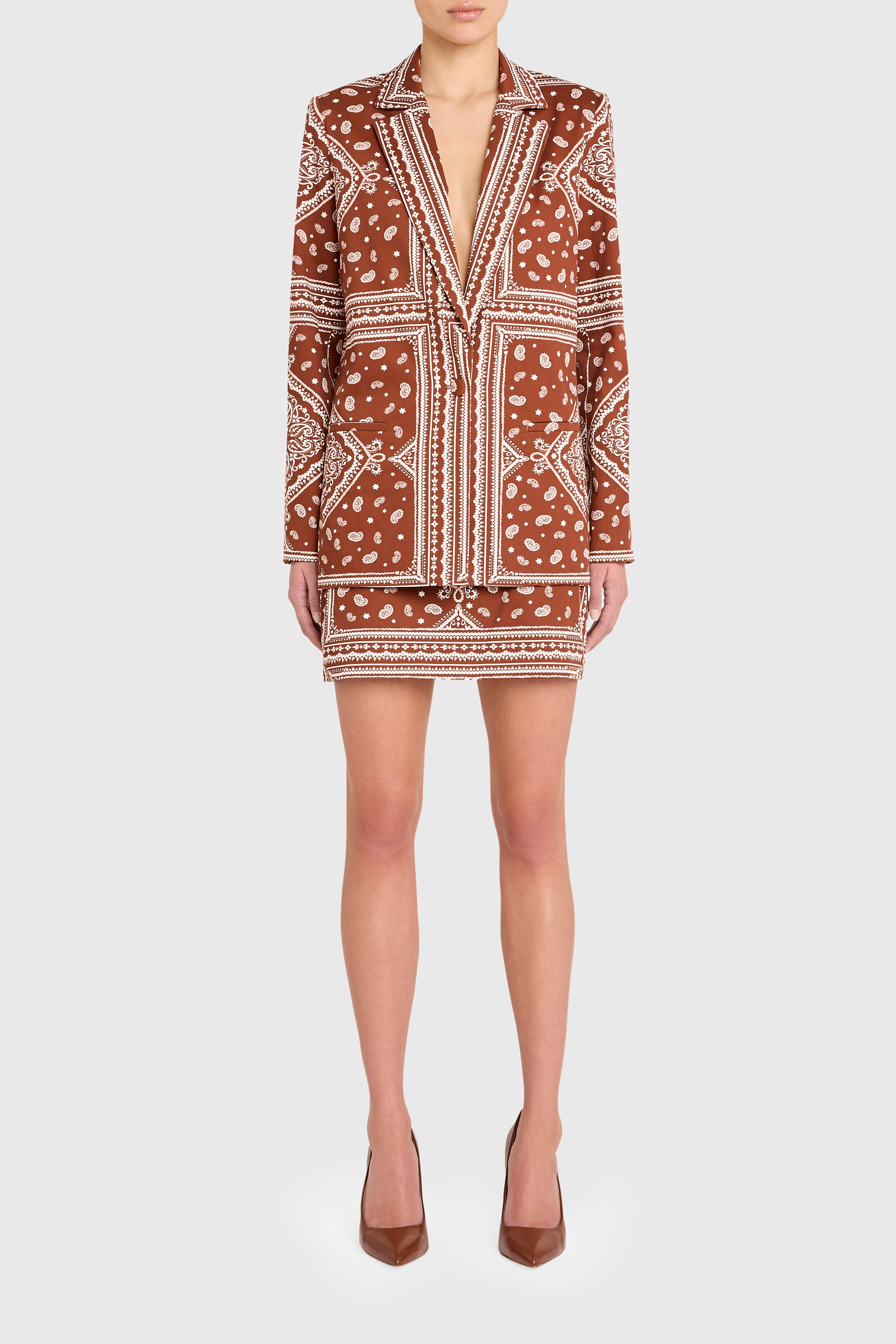 Patterned dress worn by a model on a white background