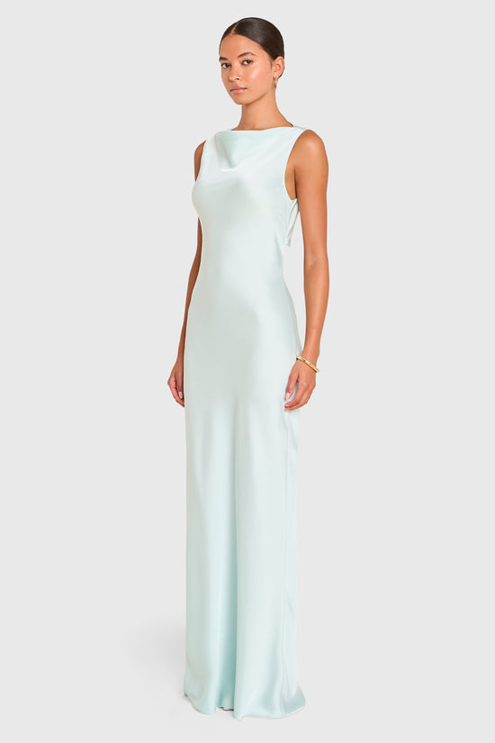 Amanda Uprichard | Roslyn Gown in Celadon Blue. Model wears a pale blue sleeveless maxi dress against a white backgorund. view 3