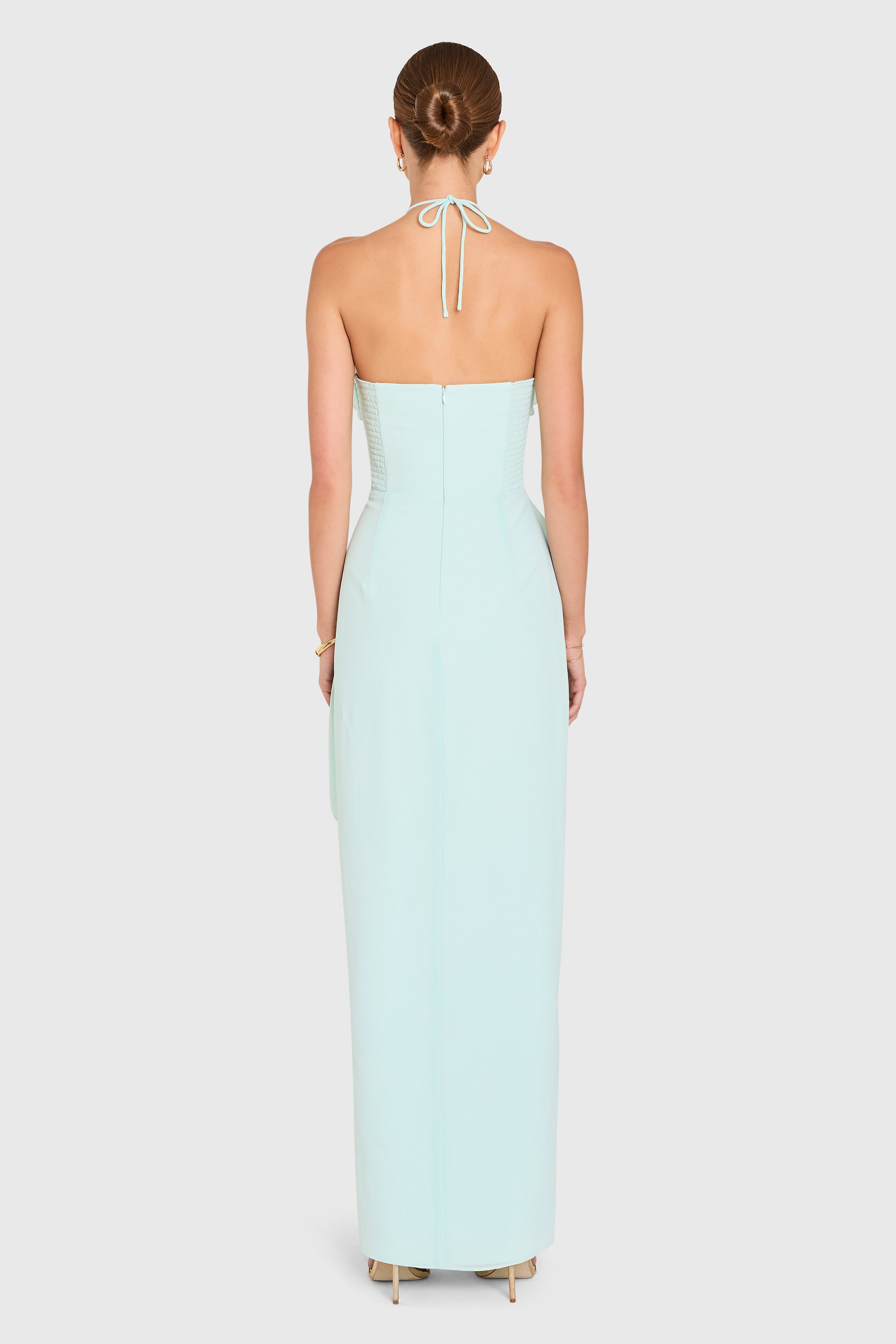 Amanda Uprichard |  Alessandra Maxi Dress in Celadon Blue. Model wears a pale blue full length gown against a white backgorund.