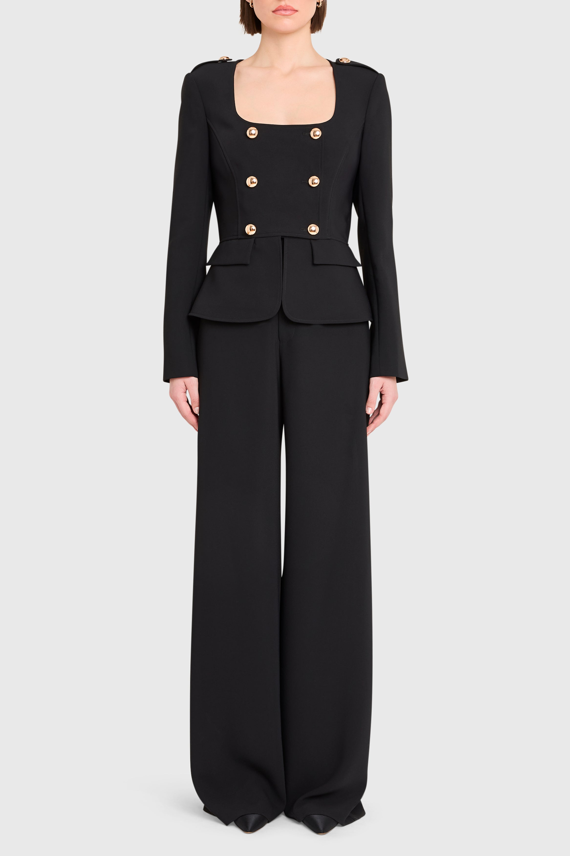 Black suit with gold buttons on a white background