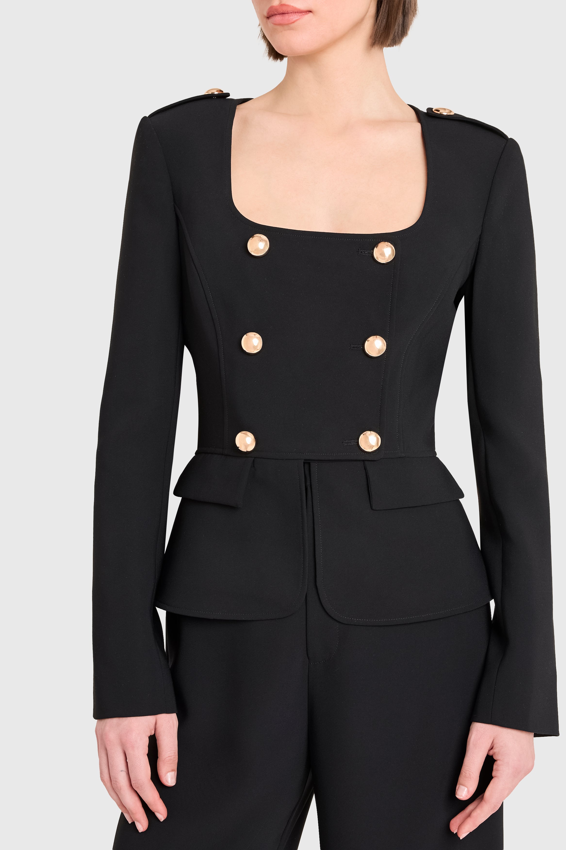 Black suit with gold buttons on a white background