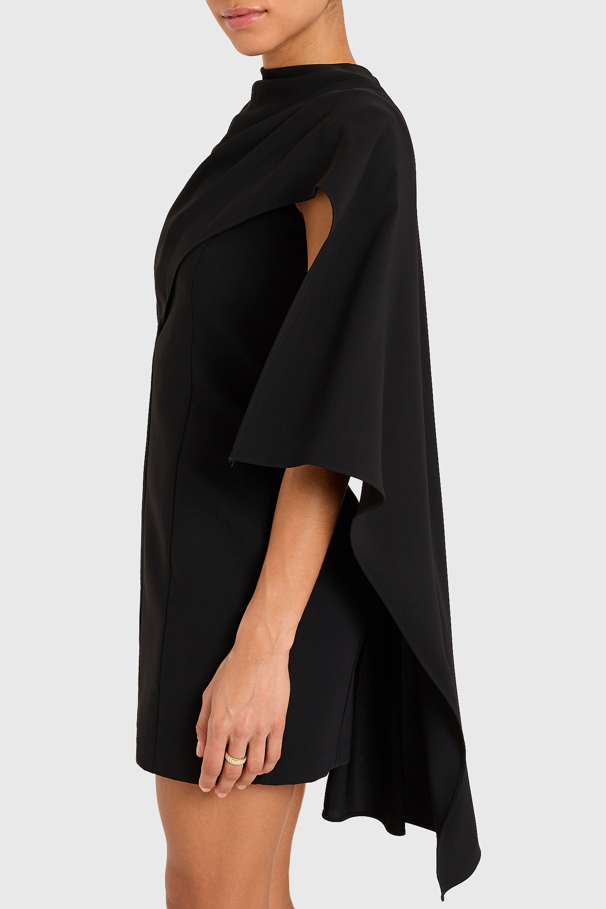 Black dress with cape on a white background