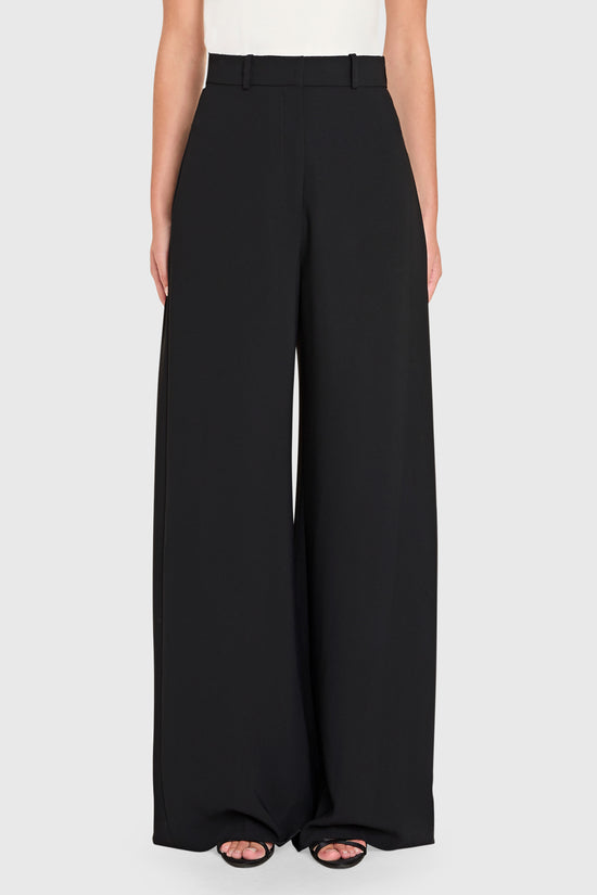 Black wide-leg pants worn by a person on a white background view 1