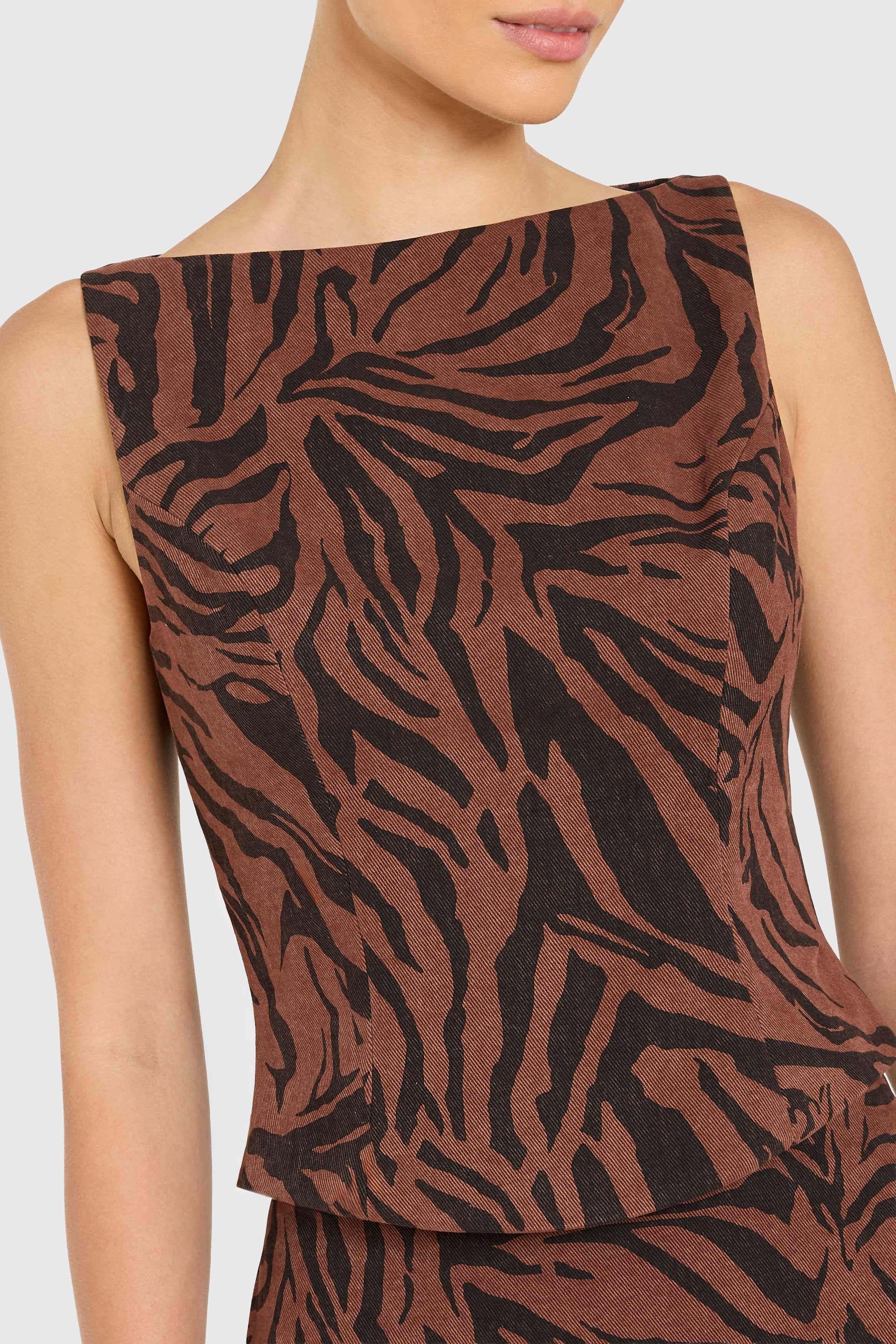 Brown and black patterned sleeveless top on a plain background