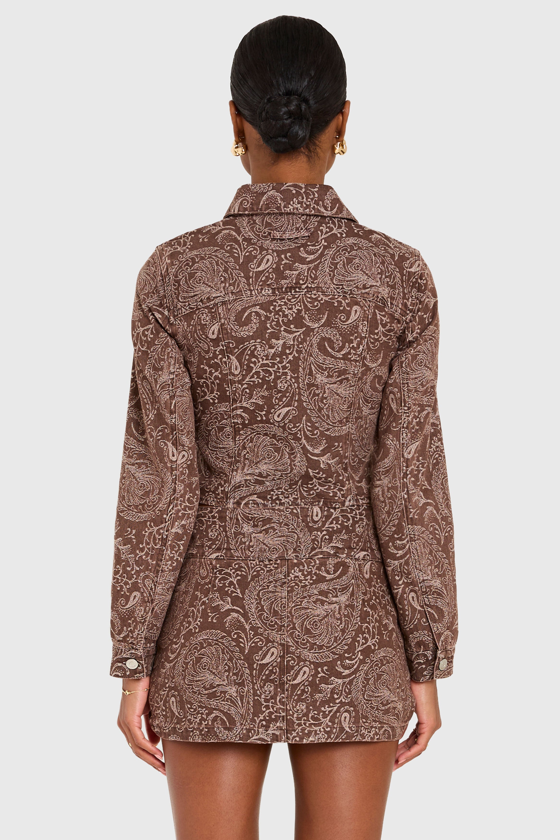 Patterned shirt dress worn by a model on a white background