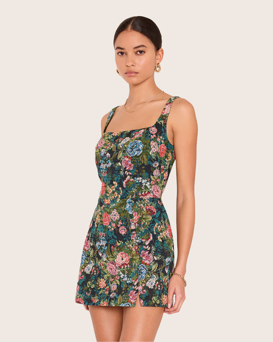 Amanda Uprichard - Shop All Bucket - model wears a floral mini dress