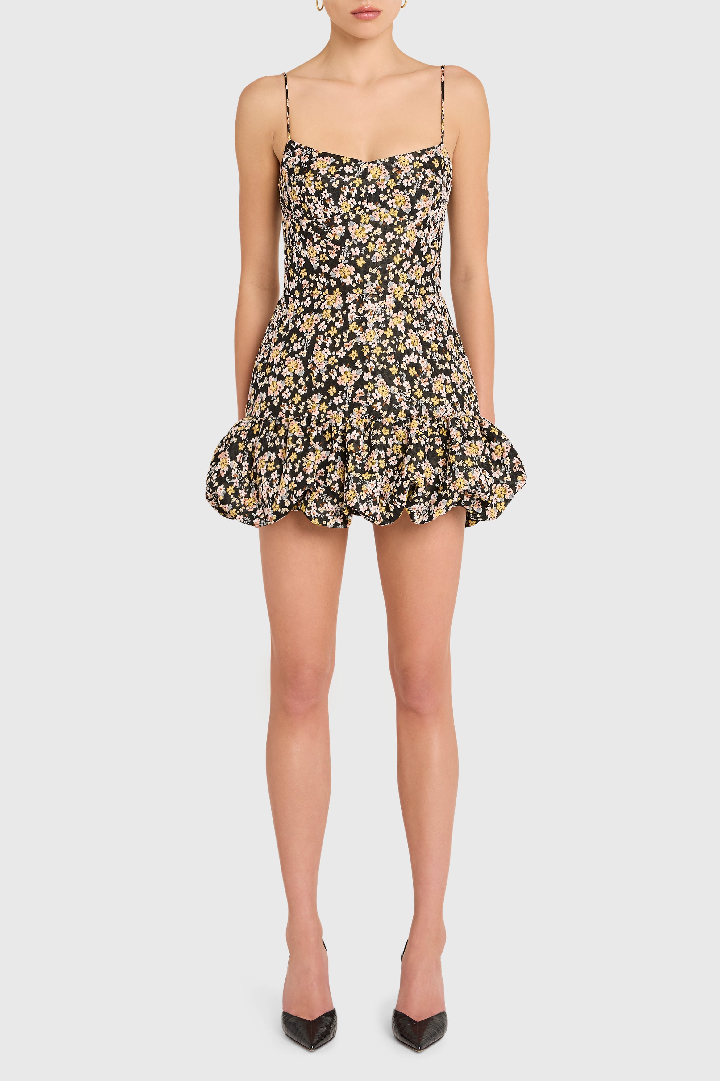 Woman wearing a floral dress on a white background