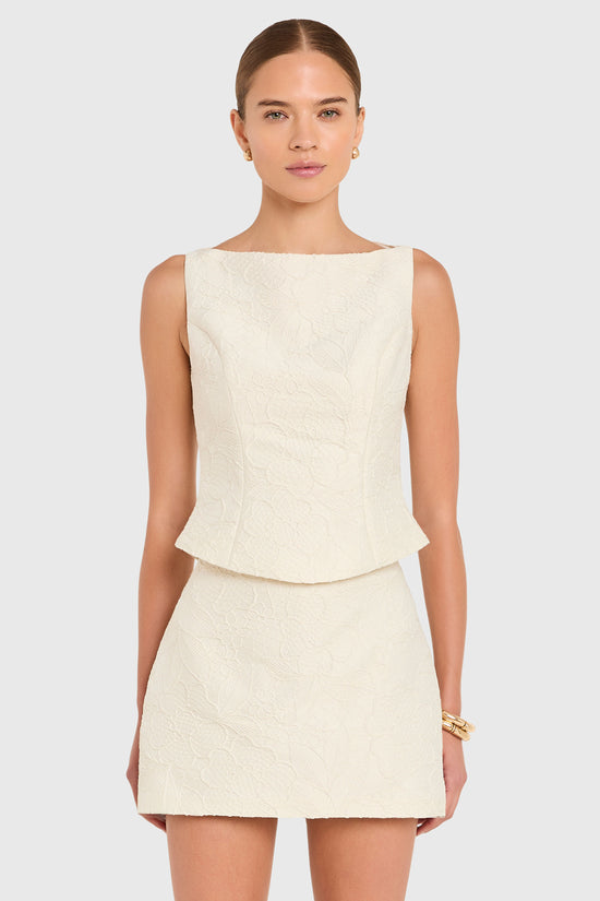 Amanda Uprichard |   Ines Top in Honeyblossom Brocade. Model wears a white sleeveless top against a white backgorund. view 2