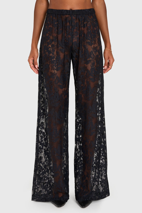 Black lace pants worn by a person on a white background view 3