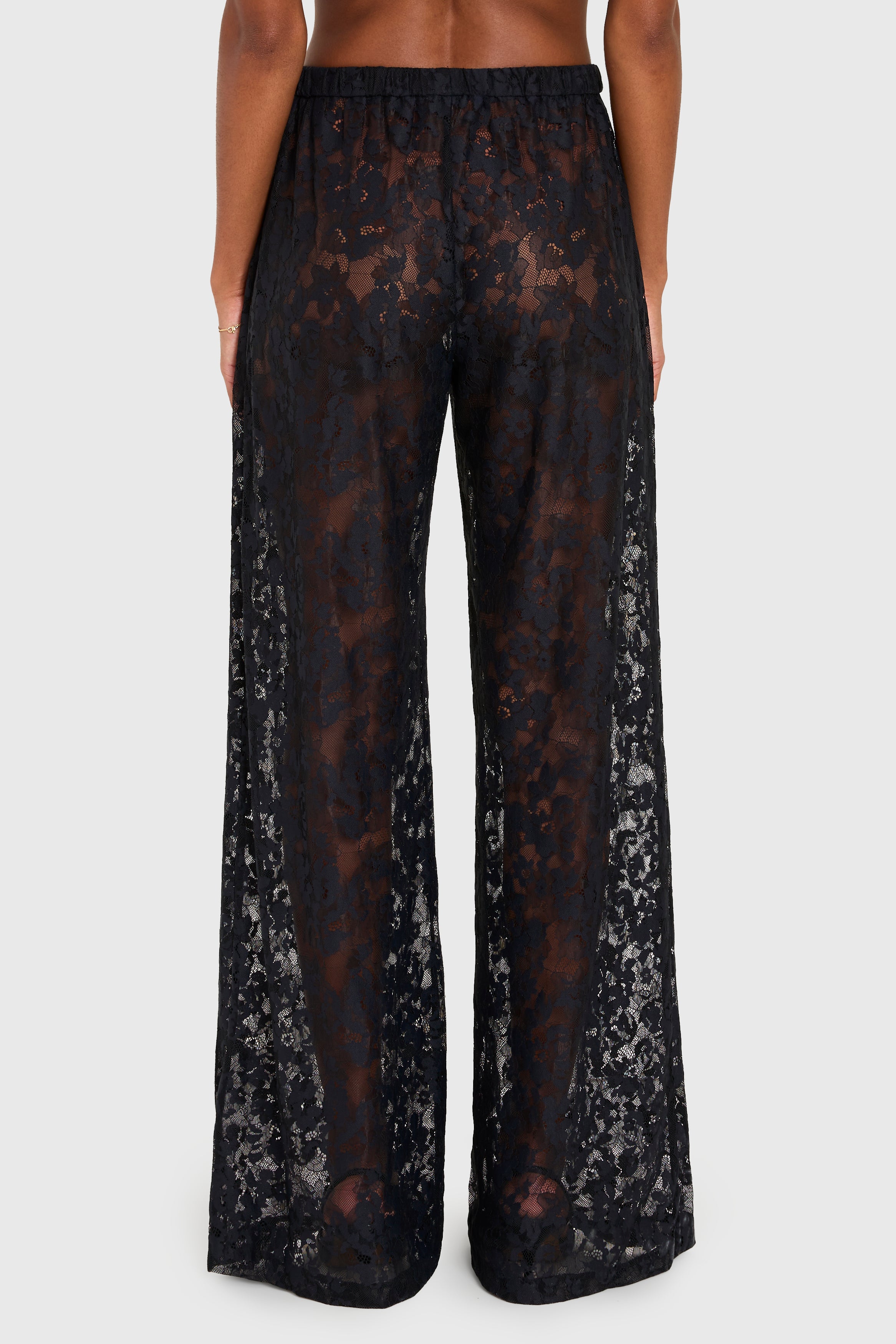 Black lace pants on a white background