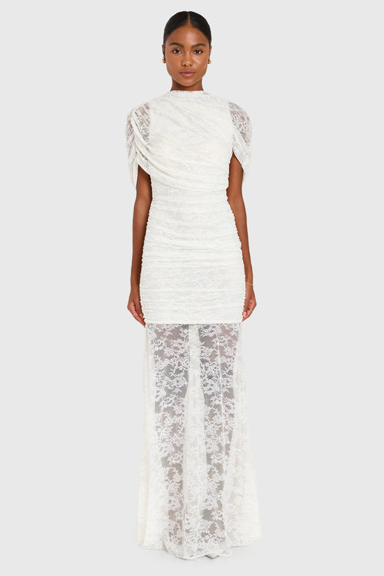 Woman wearing a white dress with ruffled sleeves on a white background view 2