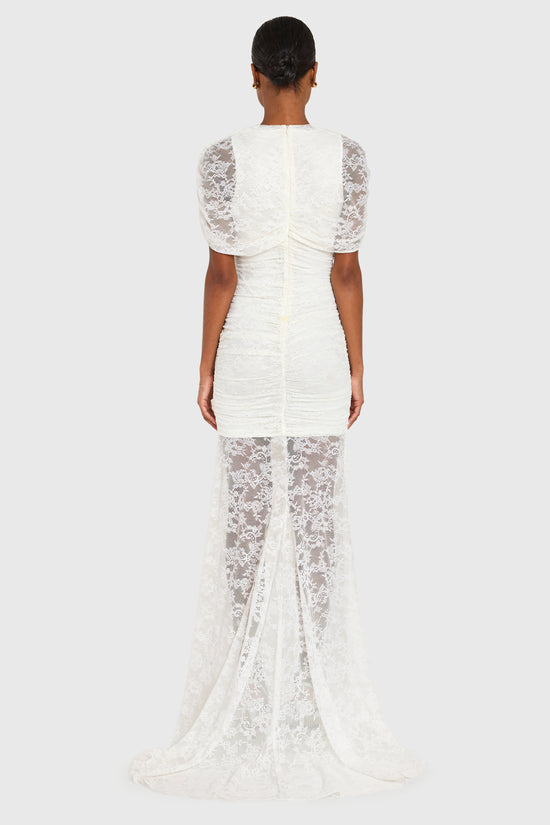 White lace dress with sheer overlay on a white background