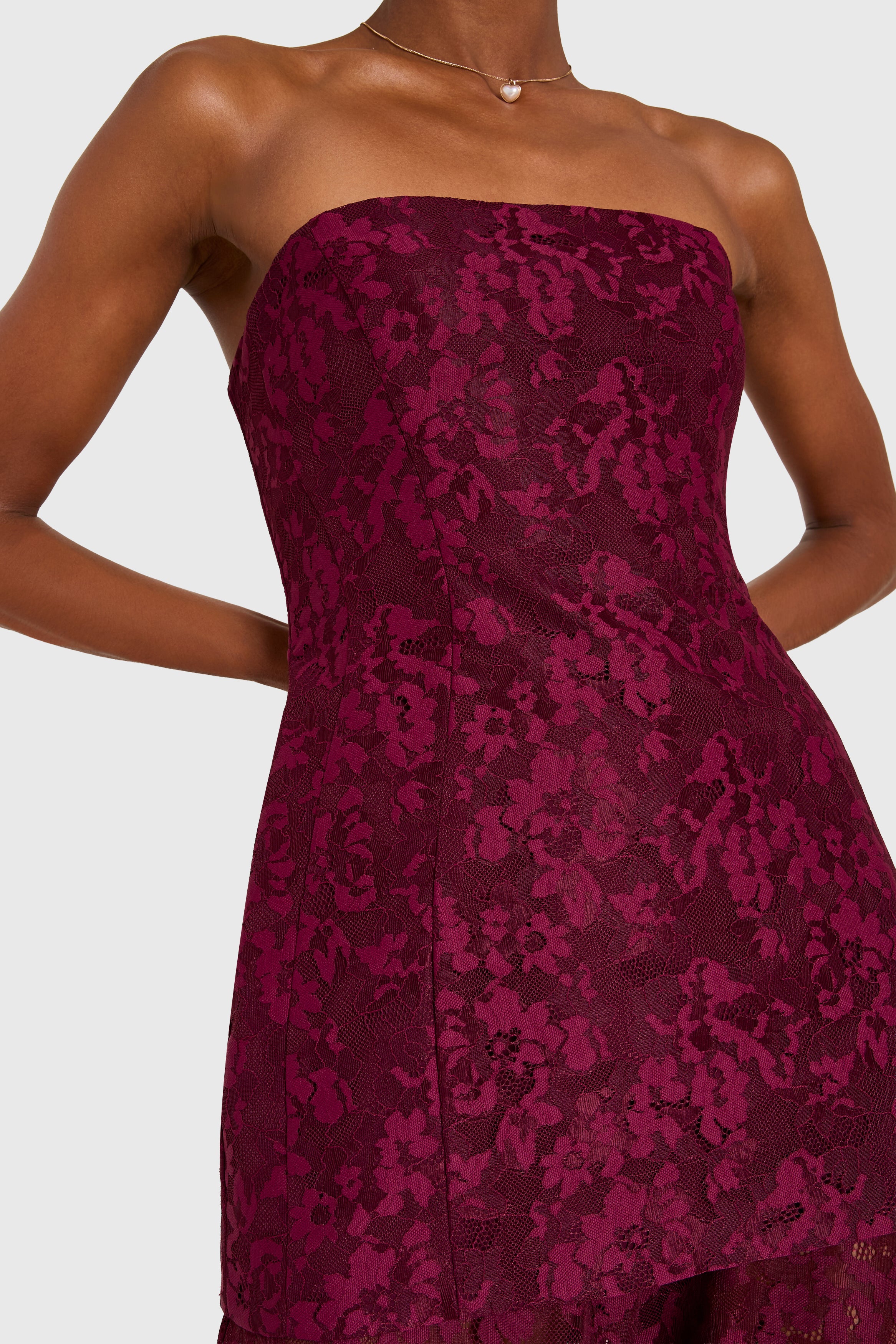 Purple strapless dress with floral pattern on a white background