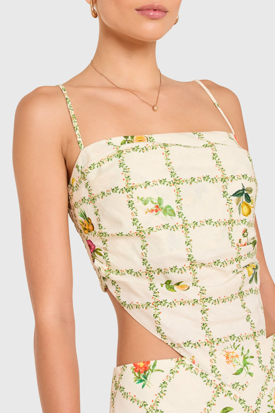 Amanda Uprichard | Juna Top in Trellis. Model wears a mini floral print top against a white backgorund. view 3