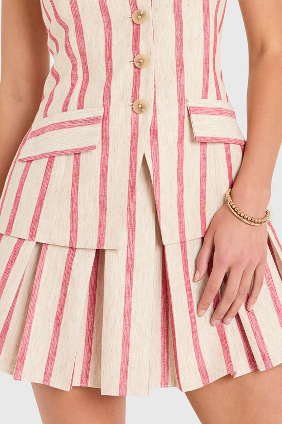 Amanda Uprichard |   Wesley Skort Romper in Red Stripe. Model wears a linen mini dress against a white backgorund. view 3