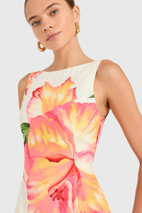 Amanda Uprichard |   Francie Romper in Hibiscus Print. Model wears a floral mini dress against a white backgorund. view 3