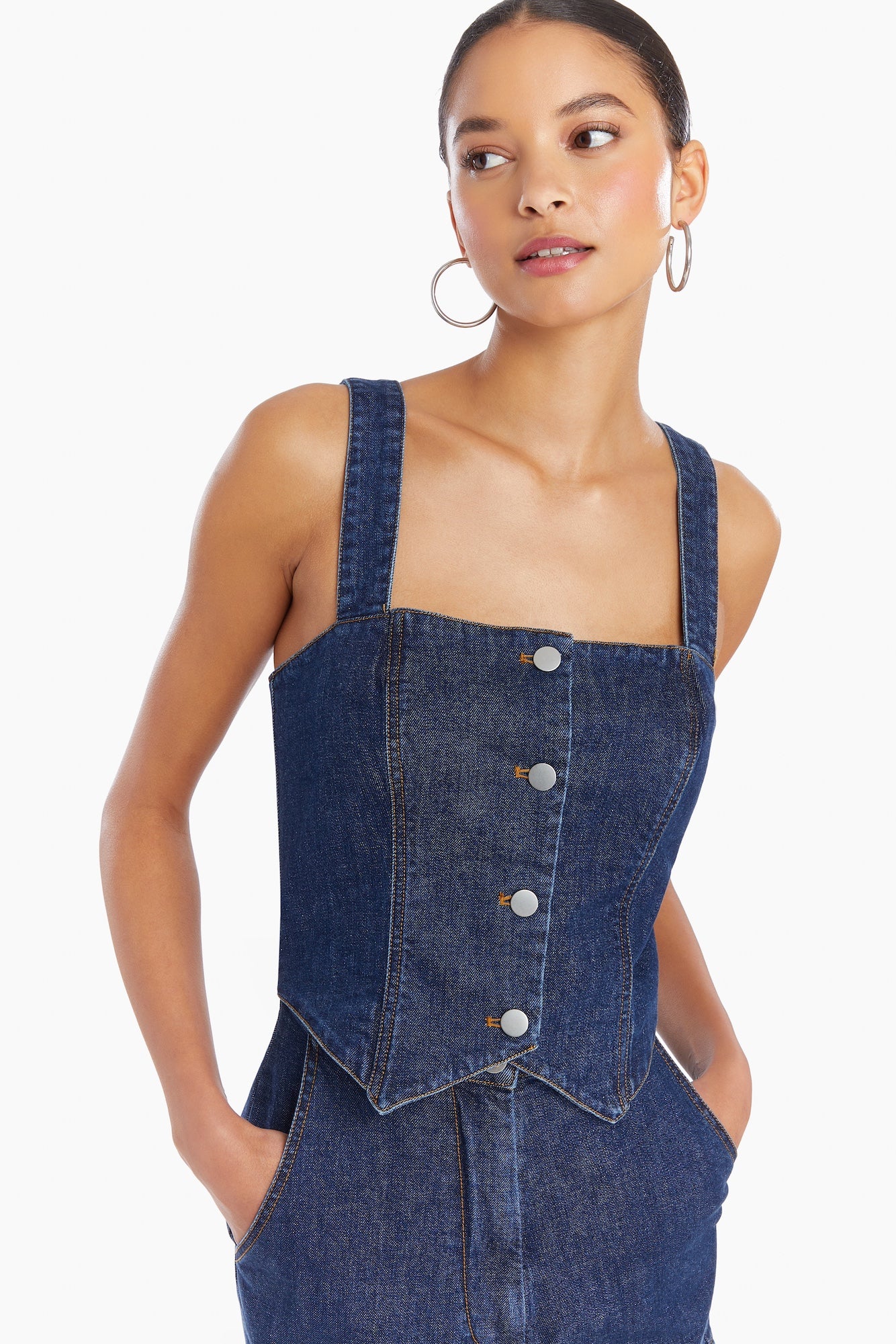 Girl in denim romper, front facing.