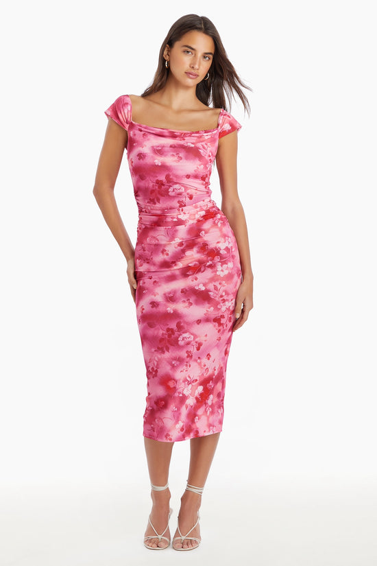 Girl in pink floral dress, front facing. view 1