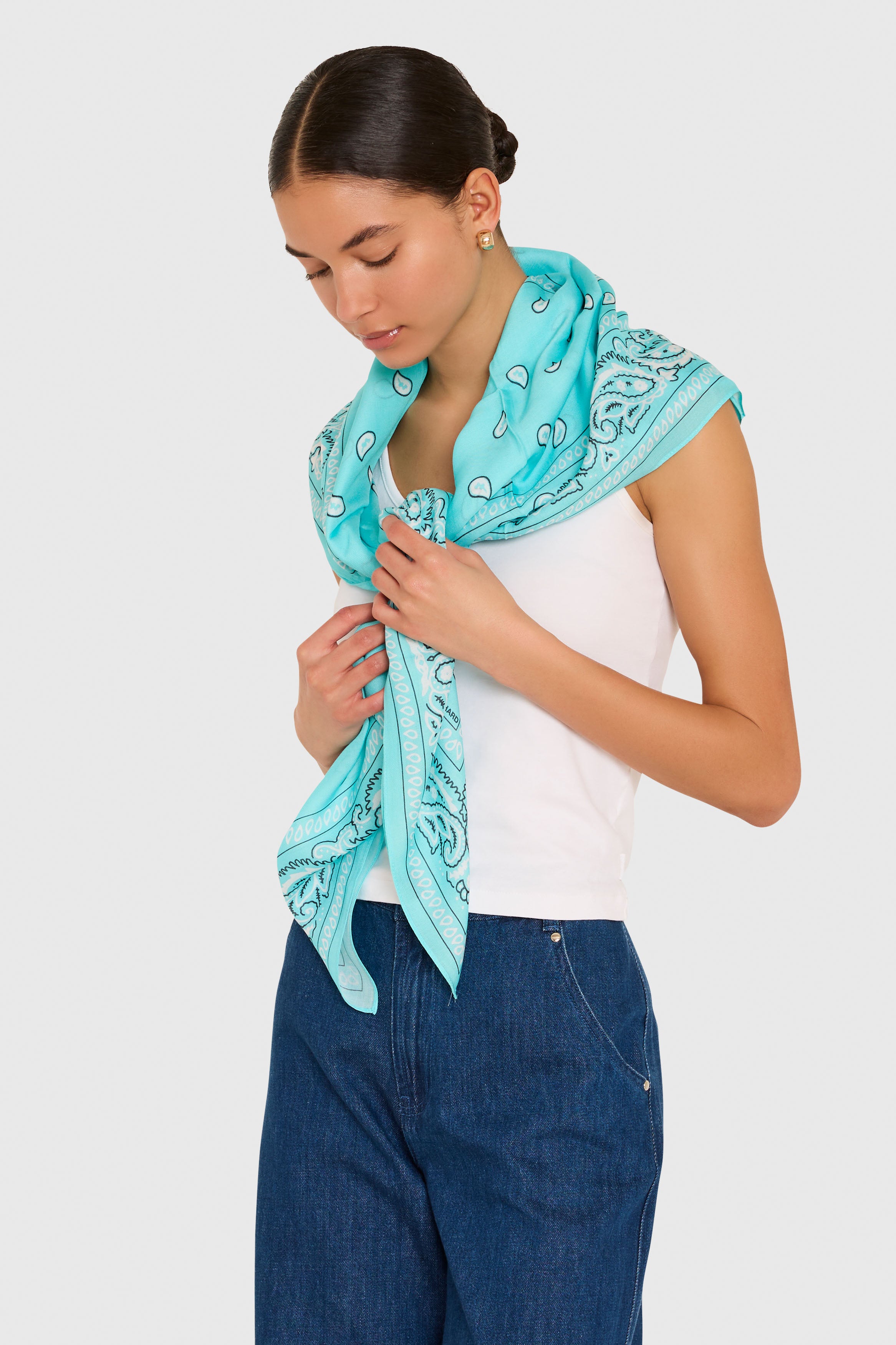 Amanda Uprichard XL Bandana Scarf in Baby Blue. Model wears scarf around her shoulders against a white background. 