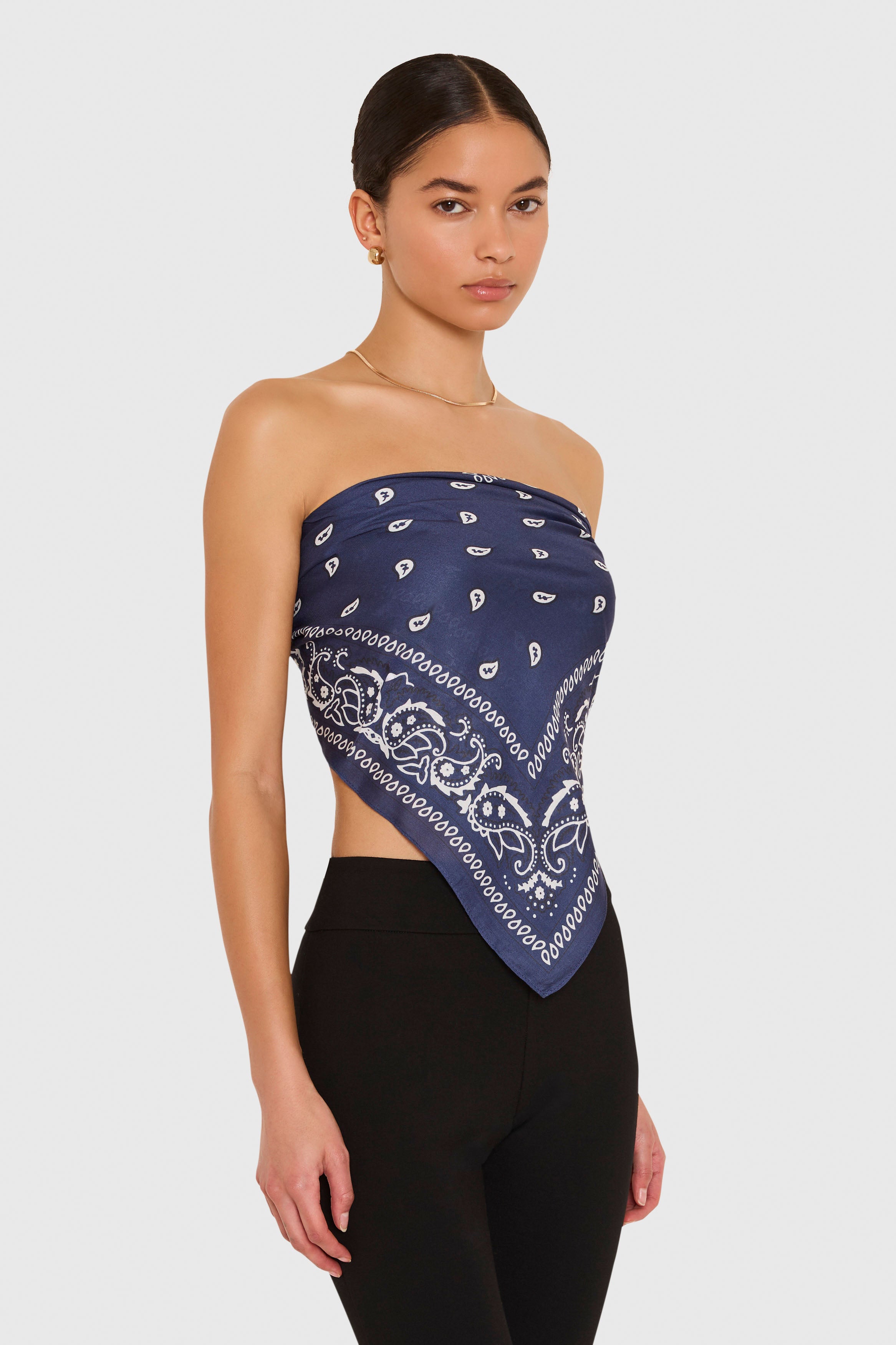 Amanda Uprichard XL Bandana Scarf in Navy Blue. Model wears scarf as a strapless top against a white background. 