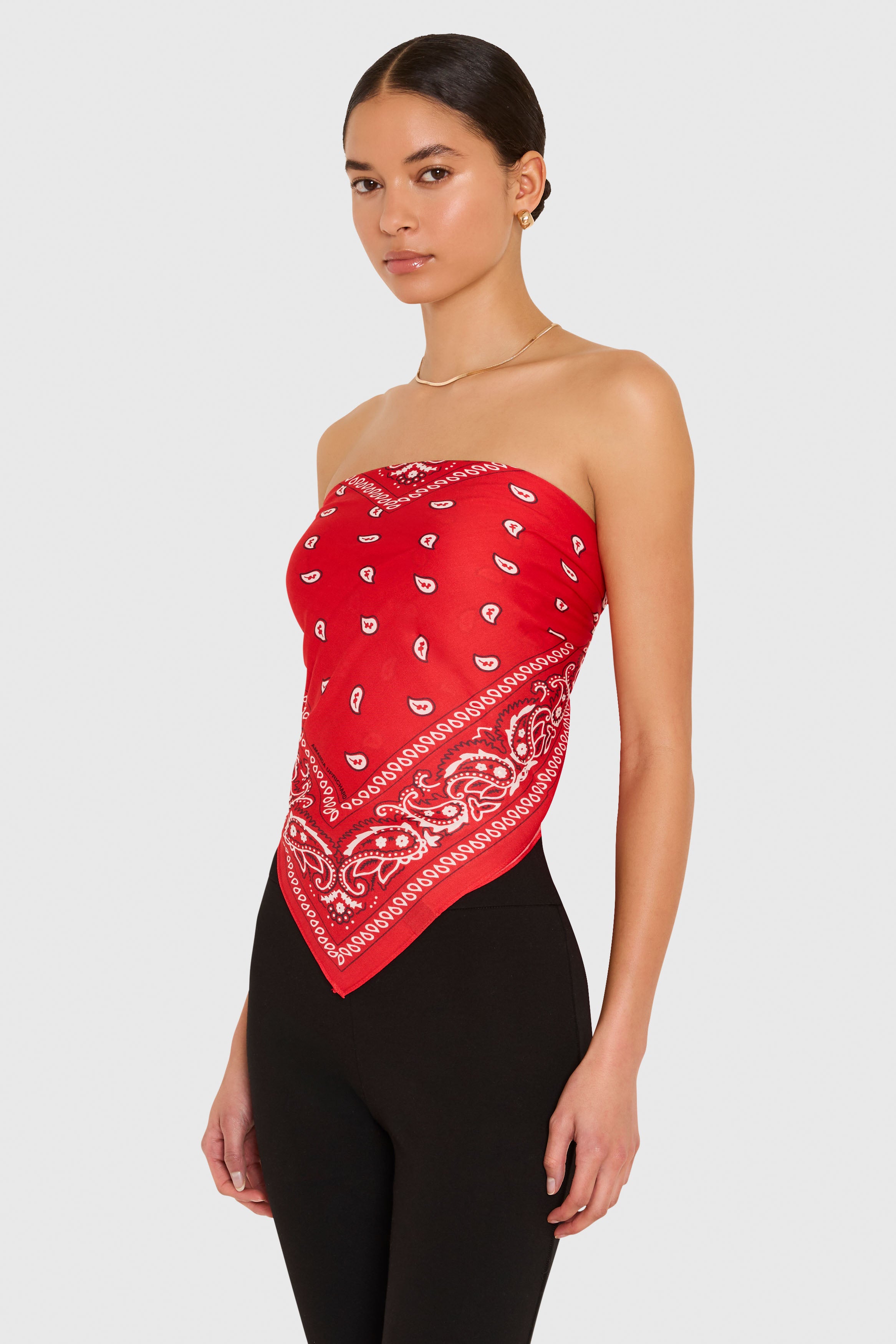 Amanda Uprichard XL Bandana Scarf in Red. Model wears scarf as a strapless top against a white background. 