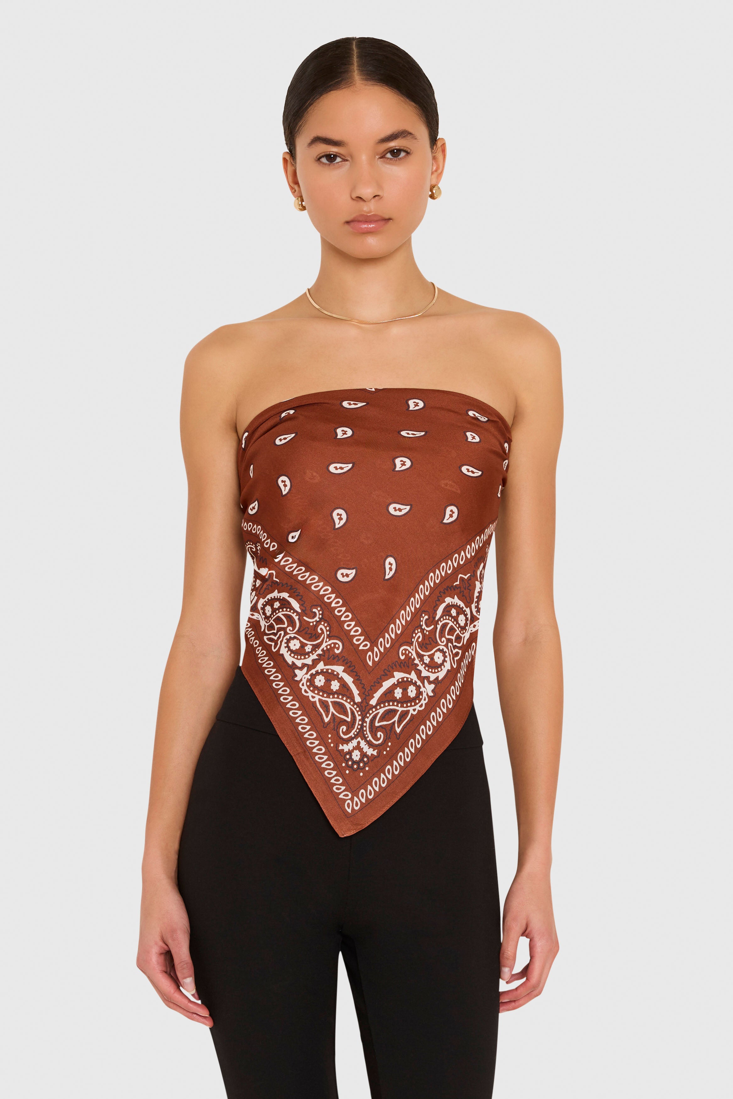 Amanda Uprichard XL Bandana Scarf in Cocoa Brown. Model wears scarf as a strapless top against a white background. 