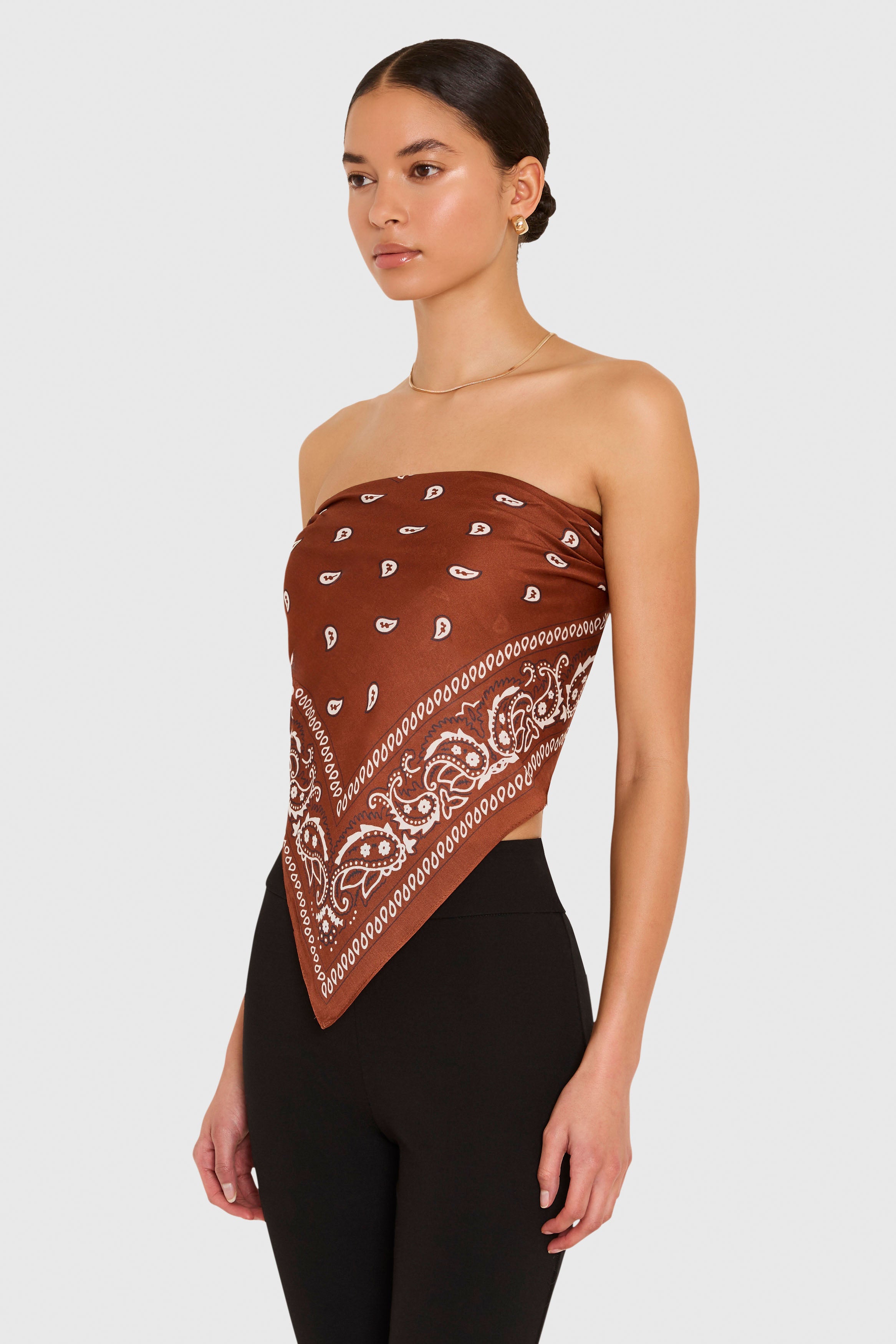 Amanda Uprichard XL Bandana Scarf in Cocoa Brown. Model wears scarf as a strapless top against a white background. 