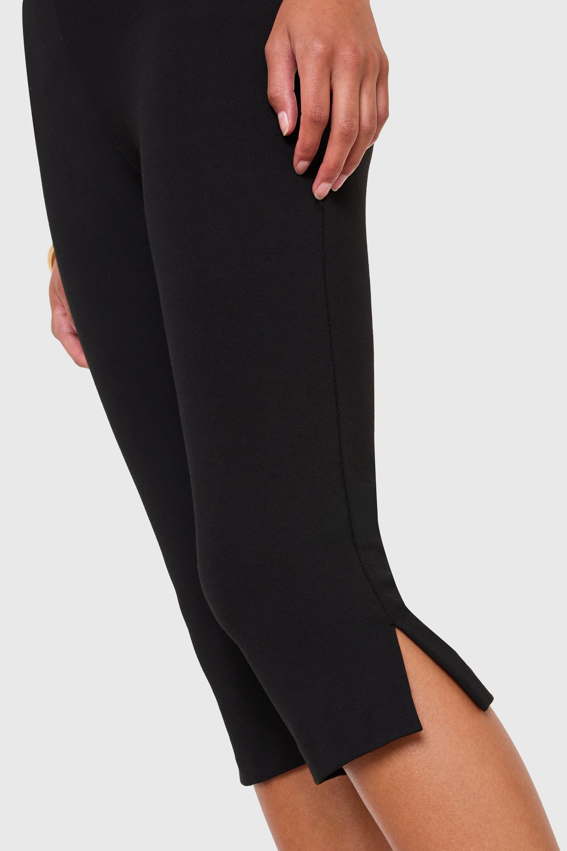 Black pants with a slit on a white background