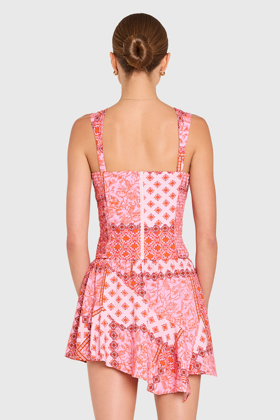 Amanda Uprichard |   Candice Top in Sardinia Print. Model wears a pink patchwork patterened top against a white backgorund. view 3