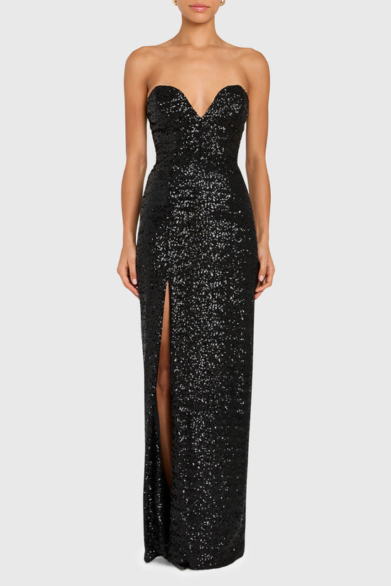 Black sequin strapless gown with a high slit on a white background view 1