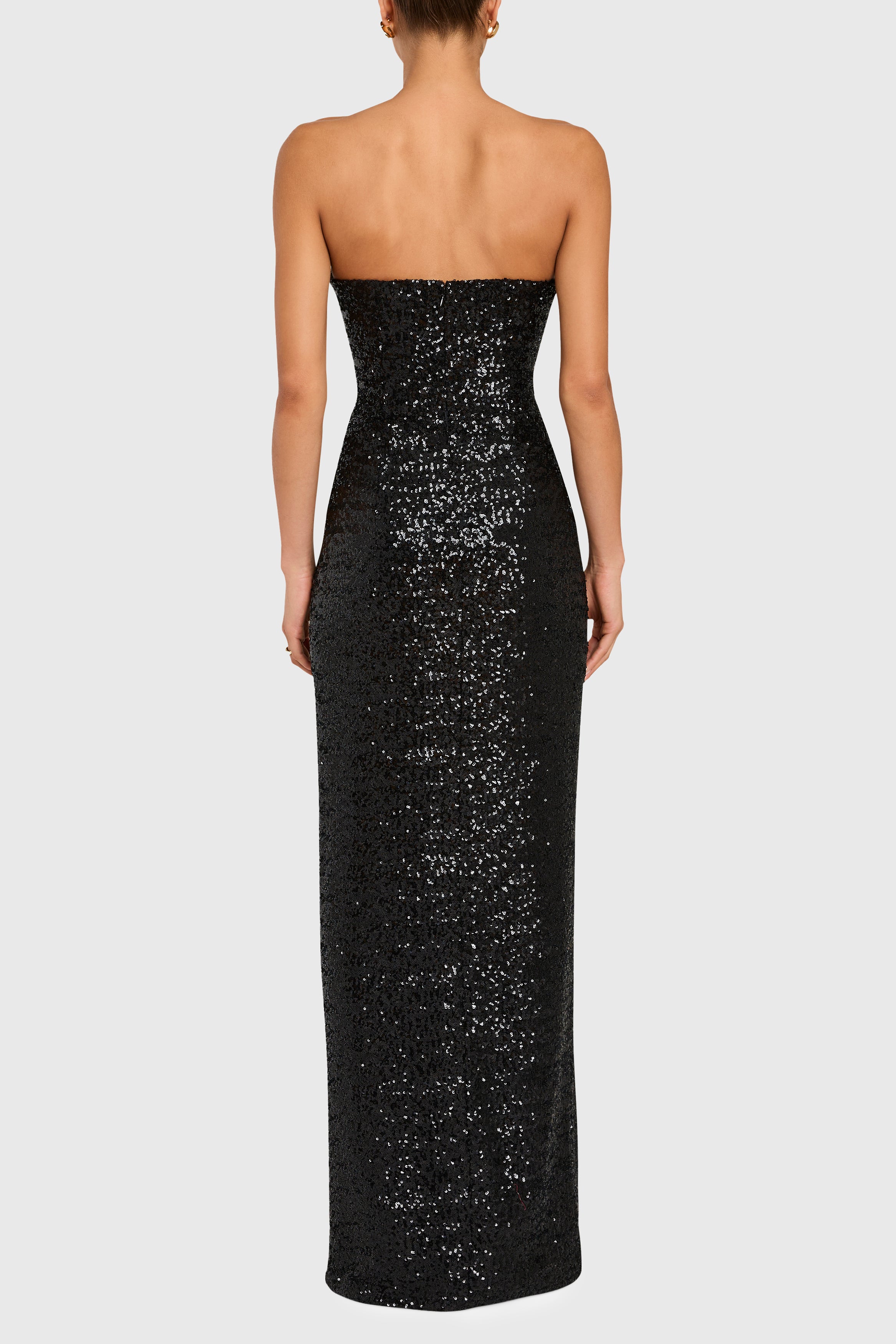 Black strapless sequin gown on a white background
