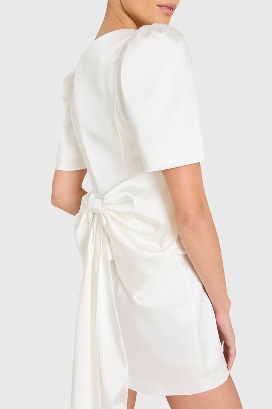 White dress with a tie waist on a white background
