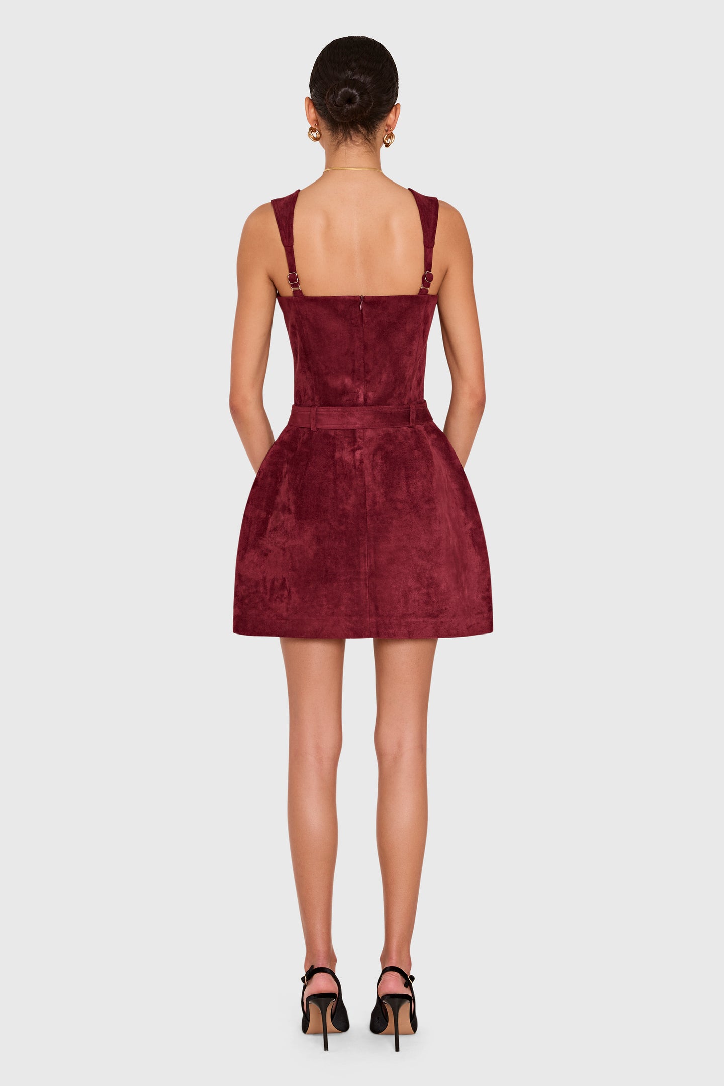 Amanda Uprichard Bethany Skort Romper in Suede in Burgundy - back view