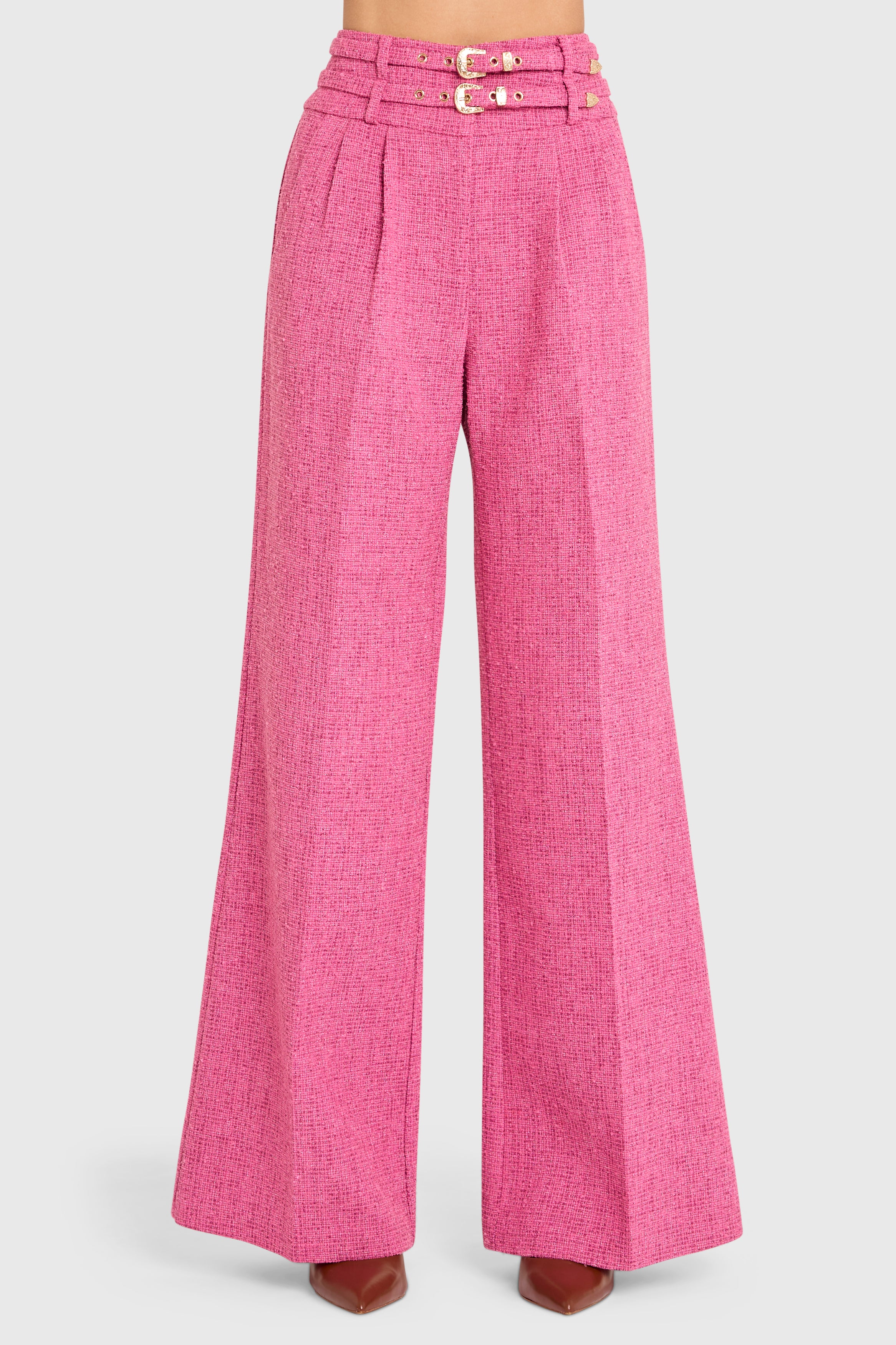 Pink wide-leg pants with a belt on a light gray background