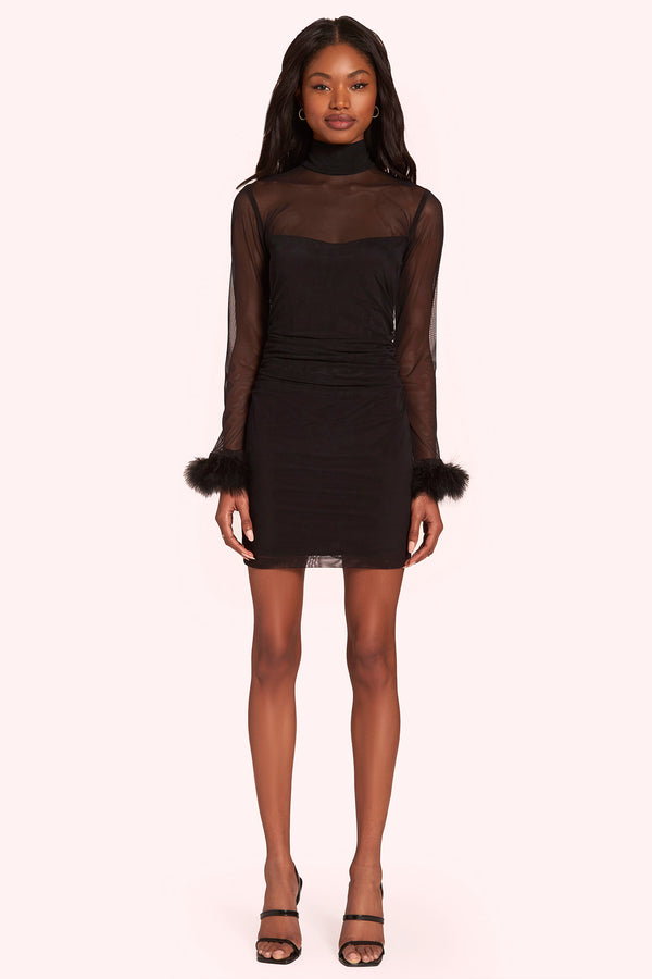 black mock neck mini dress with sheer sleeves and feather trim at wrist