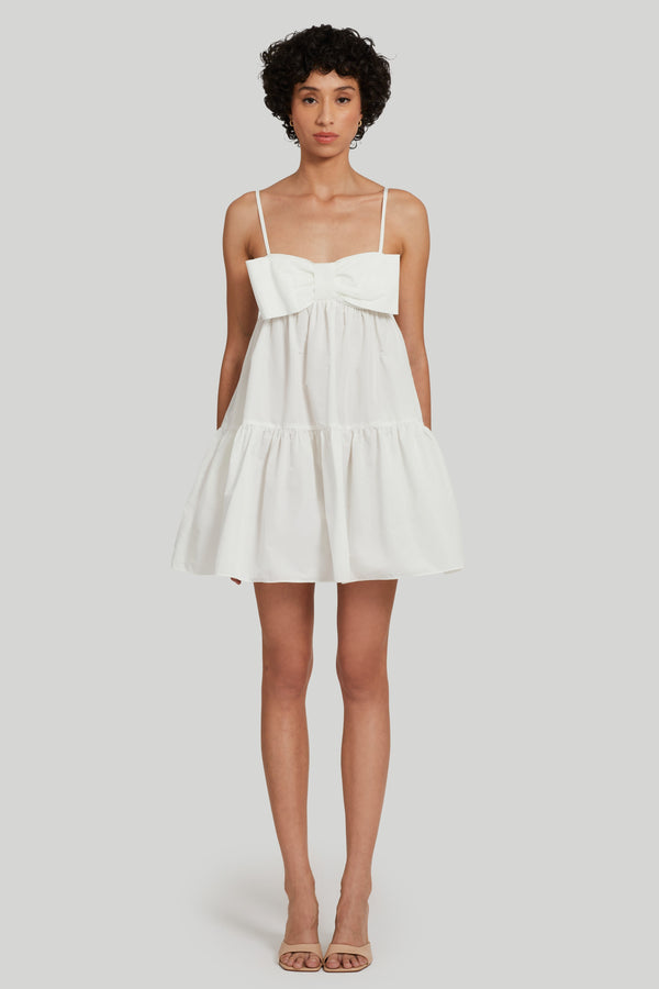 white tank strap mini dress with bow detailing on chest